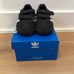 Black adidas sneakers for boys.